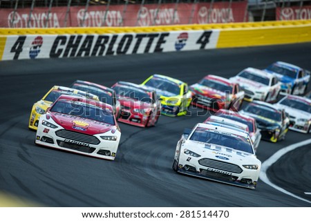 Concord, NC - May 24, 2015:  Joey Logano (22) and Brad Keselowski (2) bring the field out of turn 4 for a start during the Coca-Cola 600 at Charlotte Motor Speedway in Concord, NC.