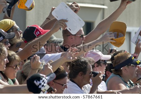 INDIANAPOLIS, IN - JULY 24:  Fans try to get their favorite drivers autographs at the Brickyard 400 race at the Indianapolis Motor Speedway on July 24, 2010 in Indianapolis, IN.