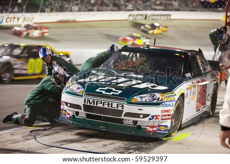 BRISTOL, TN - AUG 21:  Dale Earnhardt, Jr. brings his the Amp Energy Chevrolet in for service during the Irwin Tools Night Race race at the Bristol Motor Speedway in Bristol, TN on Aug 21, 2010.