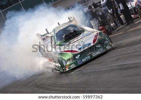 GAINESVILLE, FL - MARCH 13:   NHRA Funny Car driver, John Force, brings his car down the track during the 41st Annual Gatornationals at the Gainesville Raceway in Gainesville, FL on Mar 13, 2010