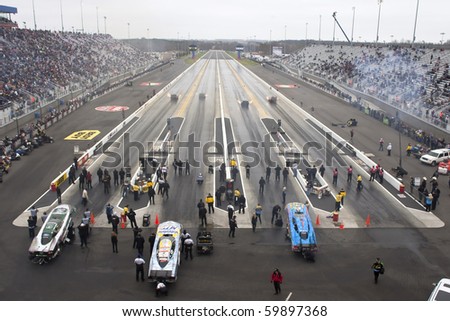 CONCORD, NC - MAR 28:  The Funny Car dragsters their stop at the zMax Dragway for the running of the inaugural Four-Wide Nationals event in Concord, NC on Mar 28, 2010