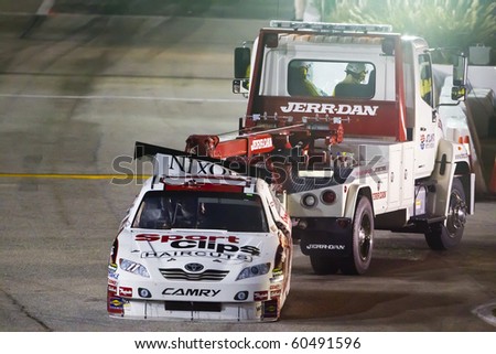 HAMPTON, GA - SEP 05:  Denny Hamlin\'s Toyota gets towed back in the garage area after blowing up during the Emory Healthcare 500 race at the Atlanta Motor Speedway in Hampton, GA on Sep 05, 2010