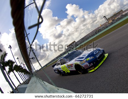 HOMESTEAD, FL - NOV 21:  Jimmie Johnson races off the back stretch for the Ford 400 race on Nov 21, 2010 at the Homestead-Miami Speedway in Homestead, FL.