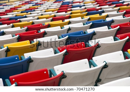 Rows of colored seats at an outdoor venue