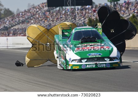GAINESVILLE, FL - MAR 12: Driver, John Force, slows his Top Fuel race car during the Tire Kingdom NHRA Gatornationals race at the Gainesville Speedway in Gainesville, FL on Mar 12, 2011.