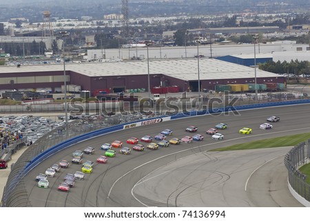 FONTANA, CA - MAR 27:  The NASCAR Sprint Cup Series teams take to the track for the Auto Club 400 race at the Auto Club Speedway in Fontana, CA on Mar 27, 2011.