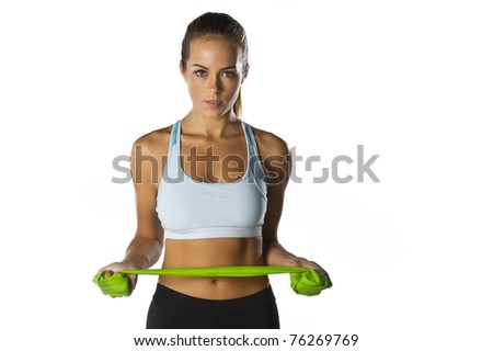A brunette fitness model preparing to work out