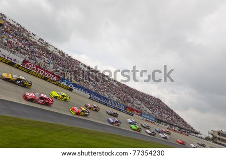 DOVER, DE - MAY 15:  The NASCAR Sprint Cup Series teams take for the FedEx 400 benefiting Autism Speaks race at the Dover International Speedway in Dover, DE on May 15, 2011.