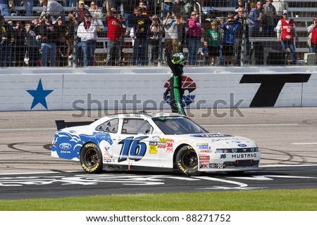 FORT WORTH, TX - NOV 05:  Trevor Bayne (16) wins the O\'Reilly Auto Parts Challenge race at the Texas Motor Speedway in Fort Worth, TX on Nov 05, 2011.