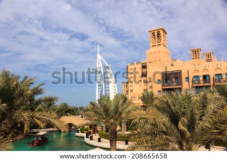 DUBAI, UNITED ARAB EMIRATES - JANUARY 3, 2011: Photo of Madinat Jumeirah hotel in Dubai with Burj al Arab background