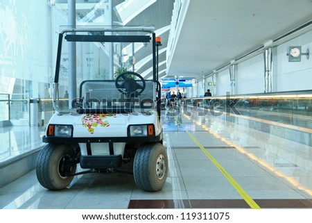 DUBAI - NOVEMBER 10: Battery operated cars in airport on November 10, 2012 in Dubai, UAE. The airport is major aviation hub in the Middle East with max throughput of 80 millions passengers per year