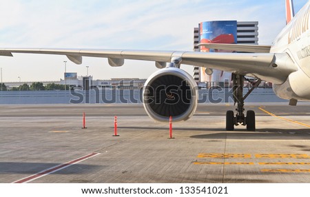 DUBAI, UAE - DECEMBER 26: Engine of Emirates plane at Dubai Airport on December 26, 2012 in Dubai, UAE. Emirates is rated as a top 10 best airline in the world flying on youngest fleet
