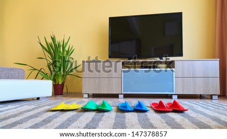 Home comfort with television and slippers