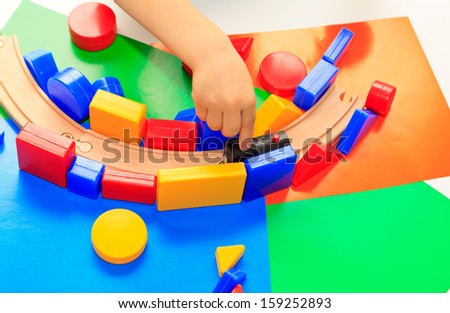 little boy playing with toys, early education and daycare concept