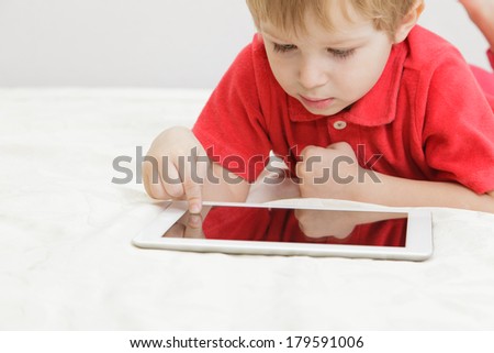 little boy with tablet, early learning