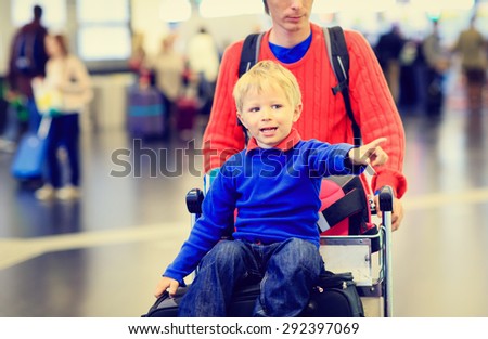 father and son travel in the airport, family travel