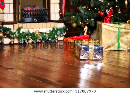 Christmas presents in living room under new year tree, winter holidays