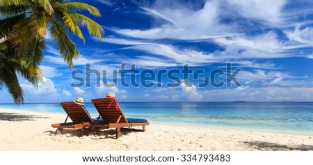 Similar – Image, Stock Photo two straw beach umbrellas on an empty seashore on a clear day