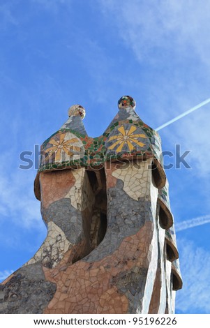 BARCELONA - JANUARY 3: The famous architect Gaudi­ treated rooftop chimneys like pieces of art on the rooftop of the house Casa Batllo on January 3, 2012 in Barcelona, Spain