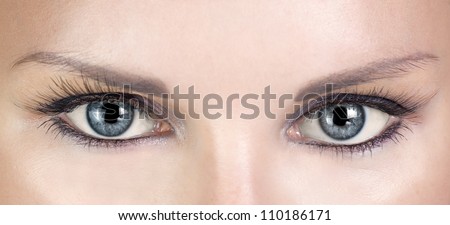 Woman blue eyes with beautiful long eyelashes