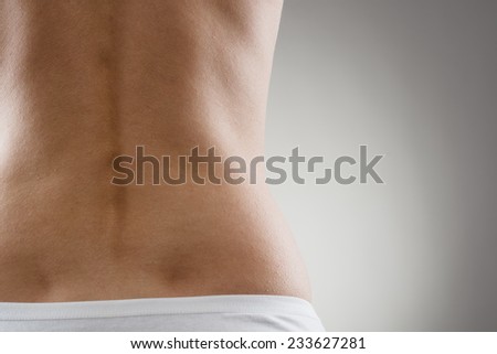 Healthy spine and loin. Close up of part of female\'s back.