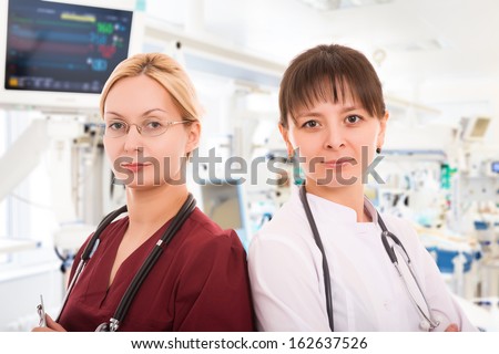 Two young female doctors in intensive care unit