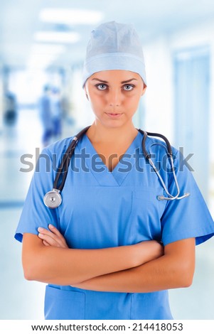 Young female medical doctor in clinic\'s corridor
