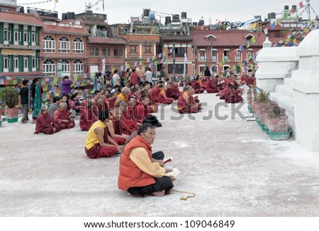 KATHMANDU - APRIL 13: Buddhist monks take part in the Five days dedication and aspiration prayers (Tungshak & Sangchoe Monlam) on April 13, 2011 in Boudnath, Nepal