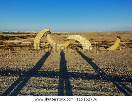 BEER SHEVA, ISRAEL - AUGUST 27:  The shadow of three photographers. The sculptures have been restored in the park near Beer Sheve August 27, 2012 in Israel