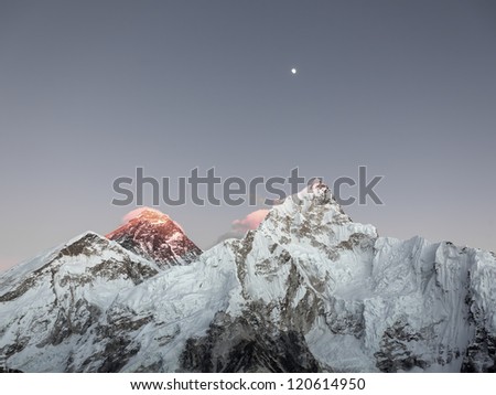 Moon over Mt. Everest (8848 m) and Nuptse (7864 m) at sunset (view from Kala Patthar) - Everest region, Nepal, Himalayas