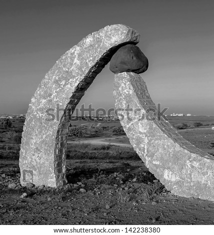 BEER SHEVA, ISRAEL - AUGUST 27:  Fragment of the stone sculptures. The sculptures have been restored in the park near Beer Sheve August 27, 2012 in Israel (black and white)