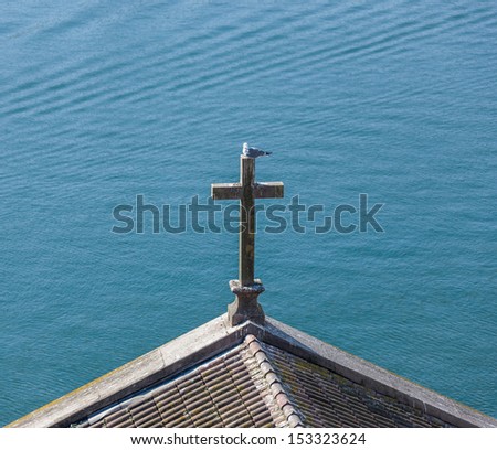 Cross over the church on the banks of the River Douro - Porto, Portugal