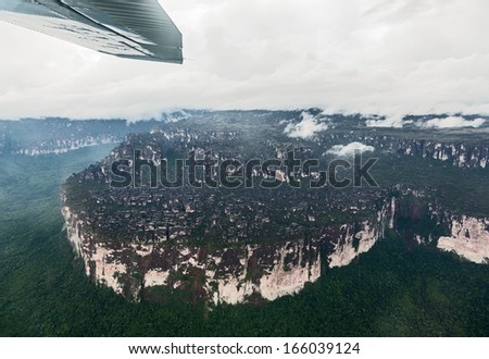 The view from the plane of the table mountain (tepyu) in the Gran Sabana region in poor weather - Venezuela, Latin America
