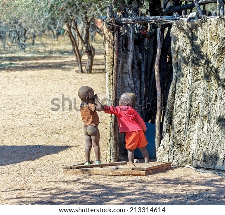 FRANSFONTEIN, NAMIBIA - JULY 09, 2014: Children from the Himba tribe. The Himba are indigenous peoples living in northern Namibia, in the Kunene region of South-West Africa