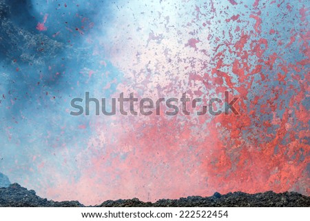 Boiling lava and volcanic bombs in a breakthrough on the slopes of the crater of the volcano cone Tolbachik - Kamchatka, Russia