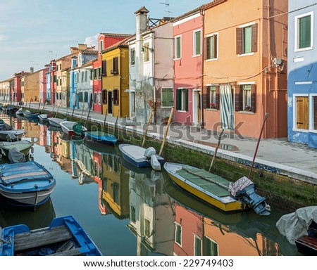 Colored houses on the shore of a narrow channel - Burano, Venice, Italy