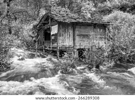The old mill. Jiuzhaigou Valley was recognize by UNESCO as a World Heritage Site and a World Biosphere Reserve - China (black and white)