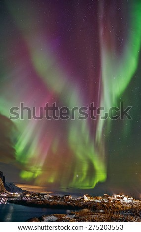 Aurora borealis (Polar lights) over the Reinefjorden - Raine, Lofoten islands, Norway