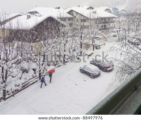 Under the red umbrella in the snow - Zell-am-See, Austria