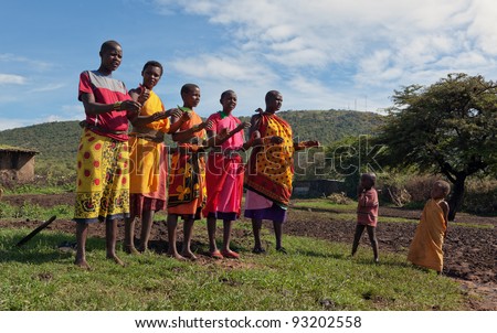 MASAI MARA, KENYA - DECEMBER 2: Women masai sing religious songs and perform traditional dances. Masai Mara National Park, December 2, 2011 in Kenya