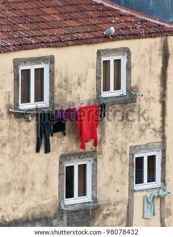 The house drying clothes on a small street  in the old quarter of Ribeira - Porto, Portugal