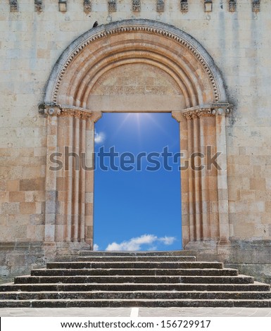 old door open with a blue sky in the background