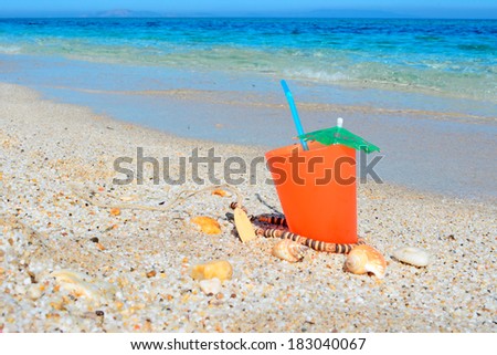 orange drink by the shore