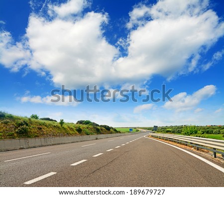 cloudy sky over a desert highway