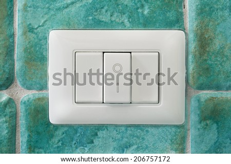 electrical switch in a blue wall