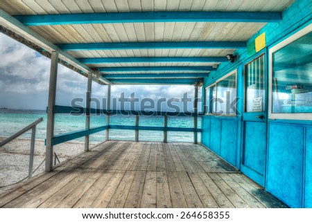 wooden terrace by the shore in Sardinia, Italy. Processed for hdr tone mapping effect