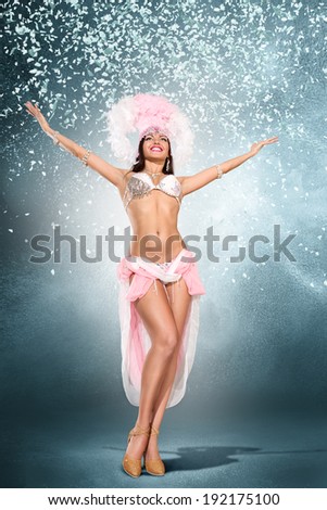 Beautiful young samba dancer in pink stage costume