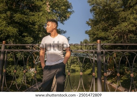 Similar – Image, Stock Photo Contemplative Asian man leaning on hand against brick building