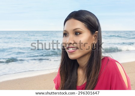 Outdoor portrait of beautiful asian girl on sea beach