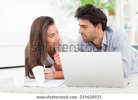 Young couple organizing their bills.